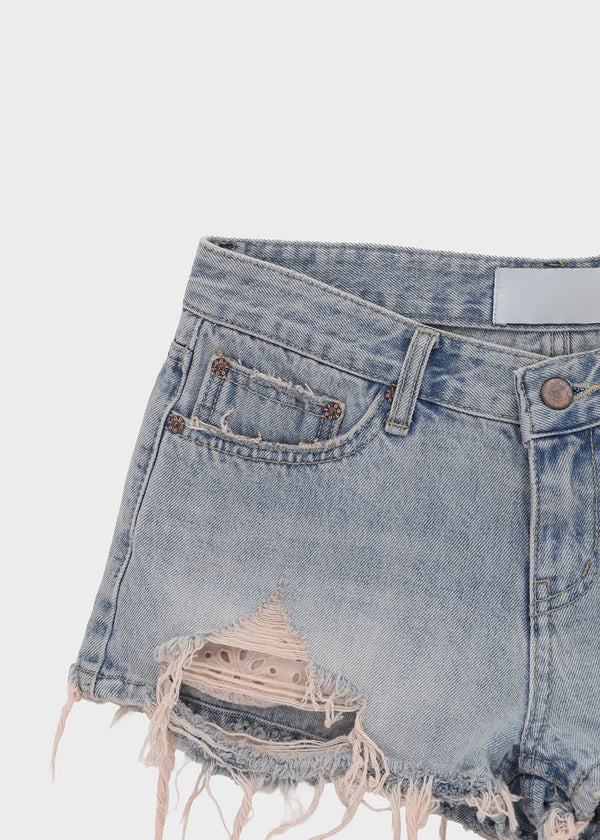 Cheeky distressed denim shorts