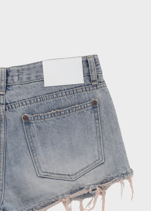 Cheeky distressed denim shorts