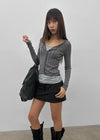 Skirt punched wool knit cardigan