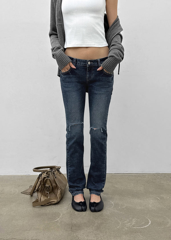 Uncut low-waist distressed skinny denim pants