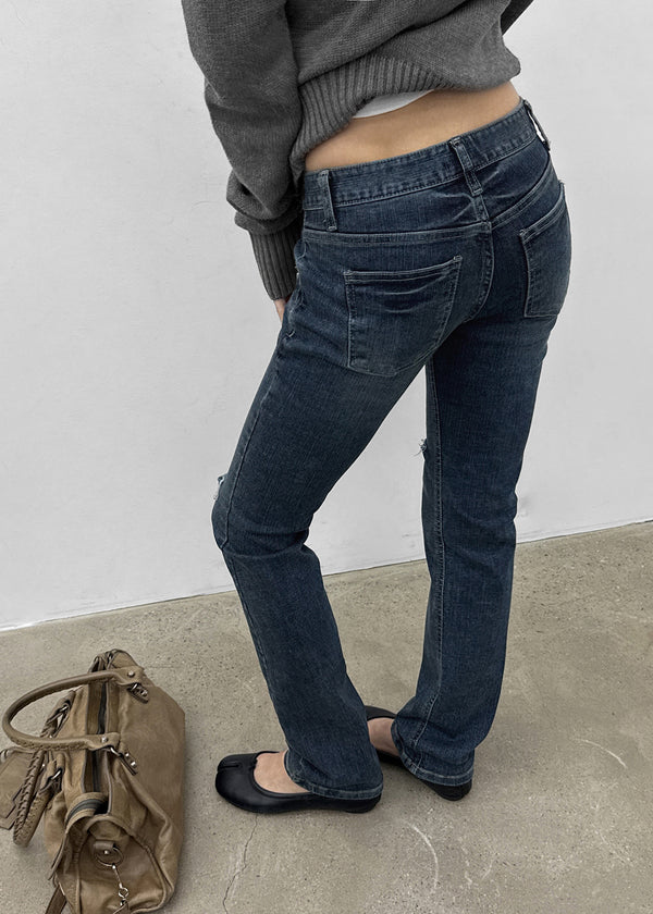 Uncut low-waist distressed skinny denim pants