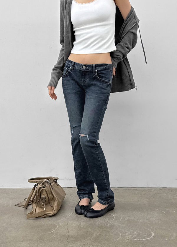 Uncut low-waist distressed skinny denim pants