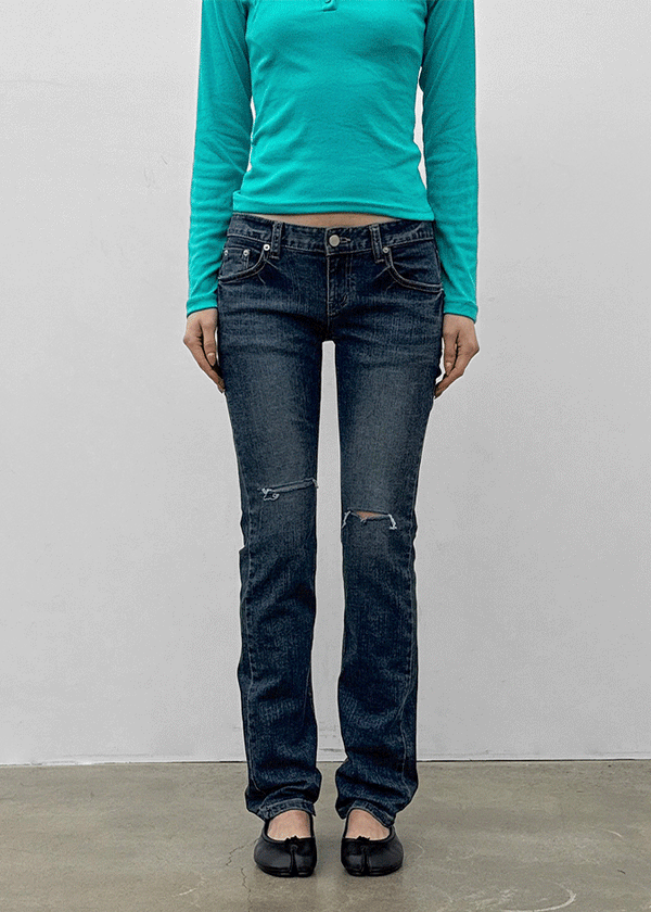 Uncut low-waist distressed skinny denim pants